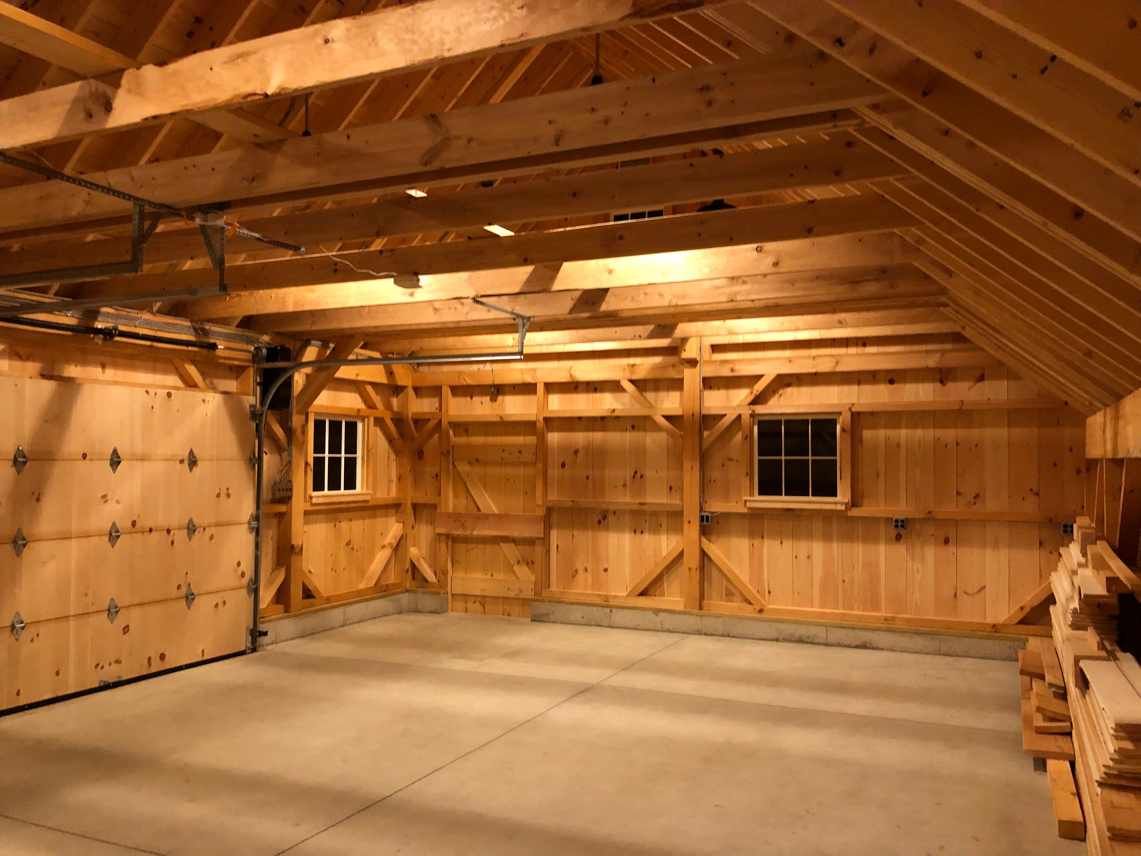 Detached garage with new sheathing and architectural shingle roof installed.